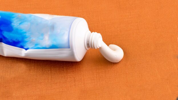 Fluoride-free toothpaste manufacturing process showing OEM formulation development and production