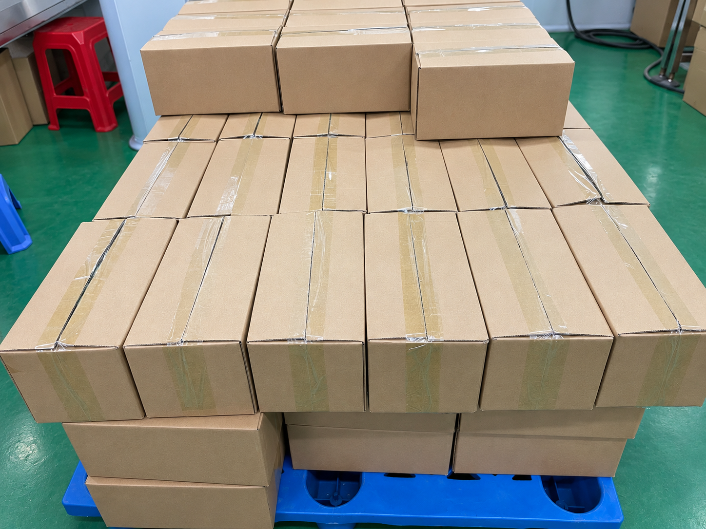Anonymized finished mouthwash packet cartons staged on a pallet for repeat-supply planning