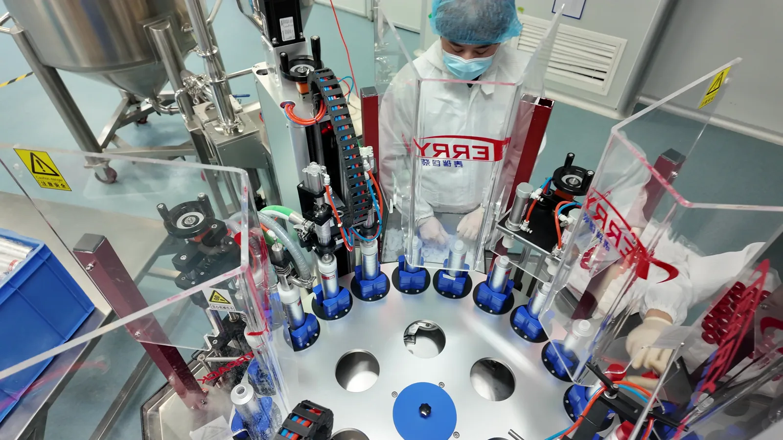 Rotary bottled-mouthwash filling and capping equipment in operation in Xiamen, China